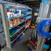 A shelving until in back of a van