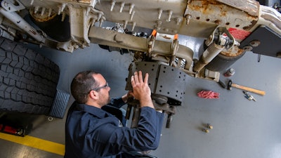 Bendix technician on brake drum