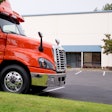 Truck parked in front of a truck dealership
