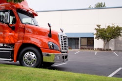 Truck parked in front of a truck dealership