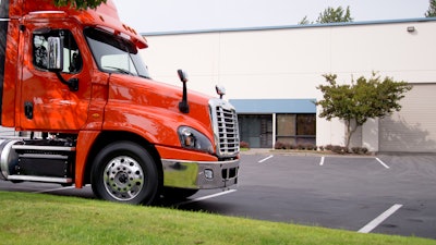 Truck parked in front of a truck dealership