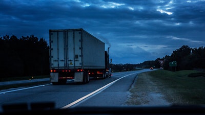 Truck on road with smoke