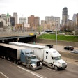 Trucks driving through Detroit on highway