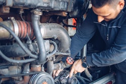 Man working inside engine