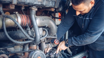 Man working inside engine