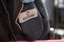 A Southland Transportation Group jacket hangs in a shop