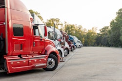 Row Of Trucks Parked In A Lot