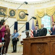 President Donald Trump, center, along with, from left, British Ambassador Peter Mandelson, Secretary of Commerce Howard Lutnick, and Vice President JD Vance, talk to reporters after reaching a trade agreement between the U.S. and Britain.
