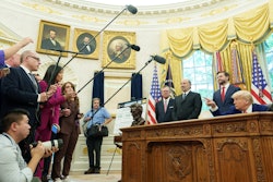 President Donald Trump, center, along with, from left, British Ambassador Peter Mandelson, Secretary of Commerce Howard Lutnick, and Vice President JD Vance, talk to reporters after reaching a trade agreement between the U.S. and Britain.
