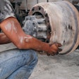 Man Replacing An Older Brake Drum
