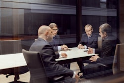 Group Of Men In A Business Meeting