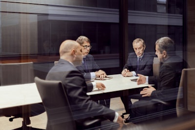 Group Of Men In A Business Meeting