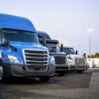Line Of Trucks In Row Starting With Blue Truck