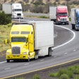 Trucks Driving On Highway
