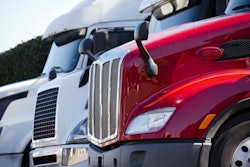 White And Red Trucks In A Lot