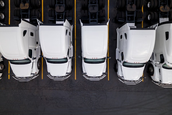Group Of White Trucks From Above