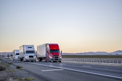 Line Of Trucks Coming Into View