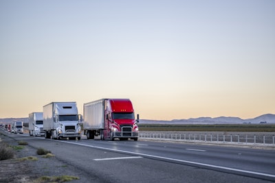 Line Of Trucks Coming Into View