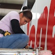 A technician works on a trailer at Stoops Trailers. The dealer, owned by McCoy Group, has 26 locations in the Midwest.