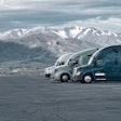 Three Trucks Parked In Rest Area In Rocky Mountains
