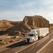 International Lt Driving Around A Mountain In Desert