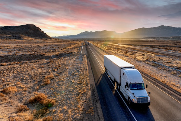 Truck Driving Isolated In Desert