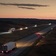 Dusk On Highway With Trucks