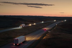 Dusk On Highway With Trucks