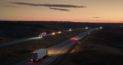 Dusk On Highway With Trucks