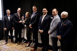 From left: Steve Williams, Interstate Billing; TPS Editor Lucas Deal; Melissa Larson, TLG; Mike Headley, TLG; Rodrigo Piccini, Procede; Craig O'Hare, National Truck Protection; and Harjeev Khanduja, Automann; recognize TLG as the winner of the 2025 Successful Dealer Award Tuesday during an awards banquet in Nashville.