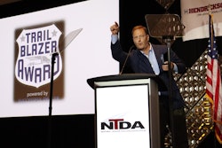 Mark Hall, general manager of Stoops Trailers, accepts the Trailblazer Award on the final night of the National Trailer Dealers Association meeting Oct. 9 in Tucson, Ariz.