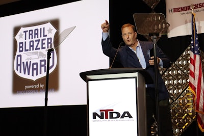Mark Hall, general manager of Stoops Trailers, accepts the Trailblazer Award on the final night of the National Trailer Dealers Association meeting Oct. 9 in Tucson, Ariz.