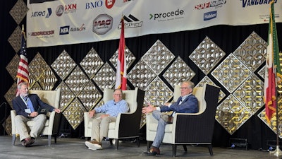 Kevin Jones, left, editor in chief of Trailer/Body Builders Magazine, moderates a panel at the National Trailer Dealers Association (NTDA) Convention with Timothy Lynch, center, senior director at Morgan, Lewis & Brockius LLP; and Ken Vieth, president and senior analyst at ACT Research.