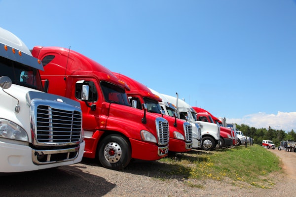 Row Of Trucks In Field