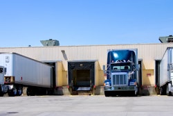 Three Trucks Parked At Dock