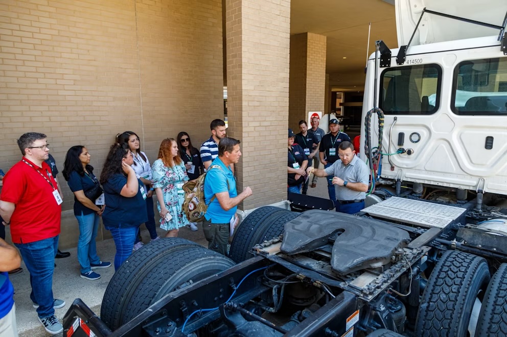 Attendees at Heavy Duty Education Week 2024 in Dallas listen to an instructor detailing vehicle components during a GenFirst course.
