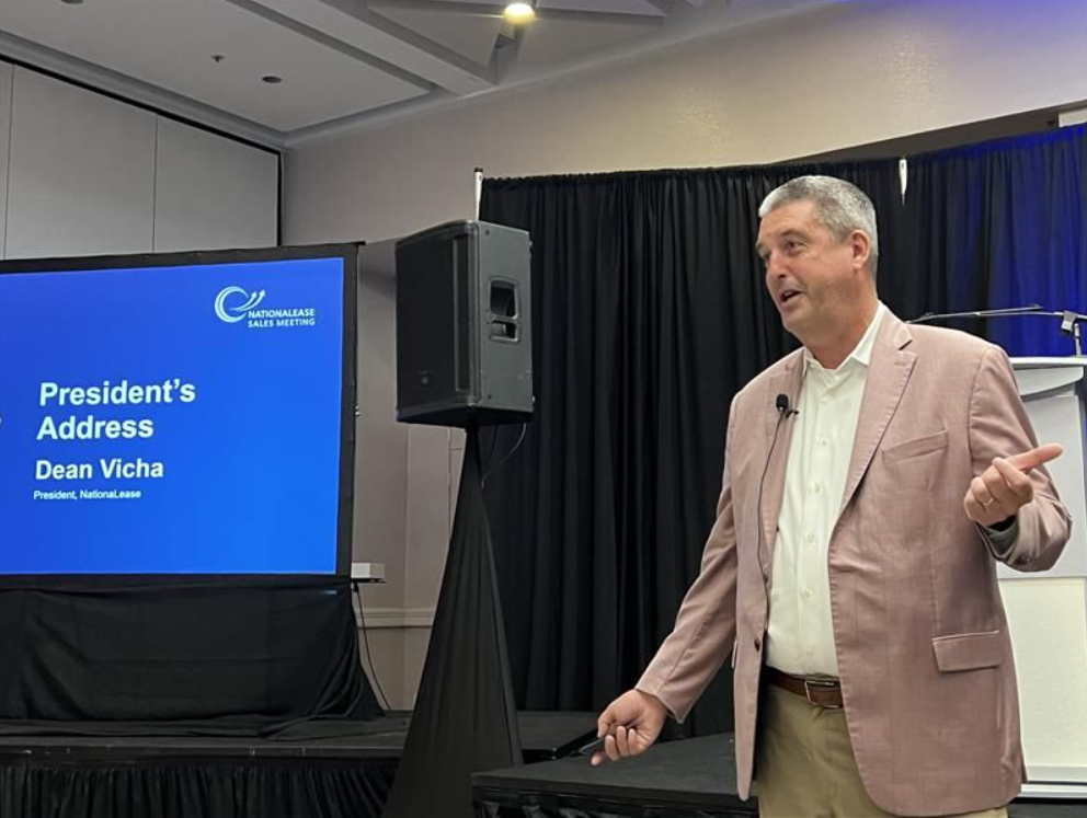 Dean Vicha, president of NationaLease, addresses attendees at the company's sales meeting and Dedicated Logistics Summit.