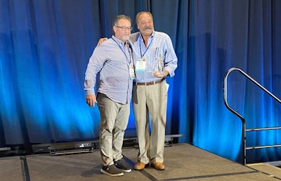 Nick Lombardo (left) presents the Marvin F. Gordon Lifetime Achievement Award to Mark Fishel (right) at the 2025 Used Truck Association (UTA) Convention Thursday in San Diego.