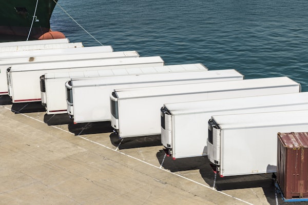 Row Of White Trailers On Pier