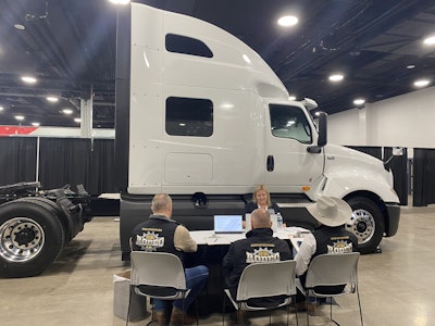 A competitor in the Heavy-Duty, International category speaks to judges at the 2025 Rush Tech Skills Rodeo in Nashville.