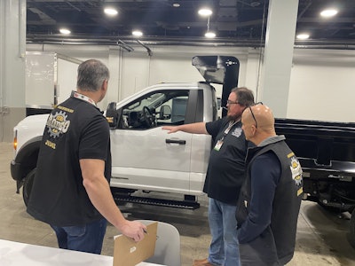 A competitor in the Medium-Duty, Ford category speaks to judges at the 2025 Rush Tech Skills Rodeo in Nashville.