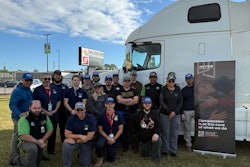 Pinellas Technical College instructors and students pose with a decommissioned truck donated to the diesel technician program by the MITER Foundation.