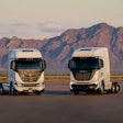 The Nikola BEV 2.0 (left) and Tre FCEV semi (right) parked outside for a publicity photo.