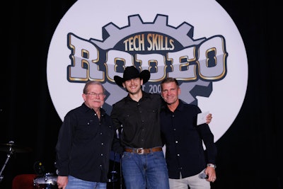 Dom McConnell (center), technician at Rush Truck Centers &ndash; Orlando South, was named the all-around Grand Champion at the 2025 Rush Enterprises&rsquo; Tech Skills Rodeo Tuesday in Nashville. He is flanked by Rush Chairman, President and CEO Rusty Rush (left) and Clint Bowyer.