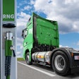 A renewable natural gas (RNG)-powered semi truck parked at a refueling station.
