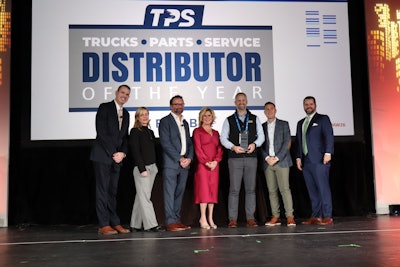 Truck Equipment Inc. President Matt Schroeder (center) is presented the 2025 TPS Distributor of the Year during the opening general session at Heavy Duty Aftermarket Week Tuesday in Grapevine, Texas.