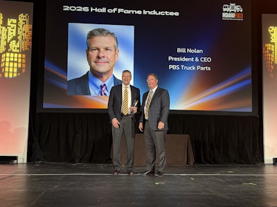 Bill Nolan (left), president at PBS Truck Parts, is announced as the latest inductee to the Heavy Duty Aftermarket Hall of Fame Tuesday at Heavy Duty Aftermarket Week in Grapevine, Texas.