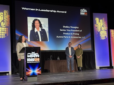 Shelley Sheagley, senior vice president of product and pricing Aurora Parts & Accessories, accepts the Women in Leadership Award at Heavy Duty Aftermarket Week 2026.