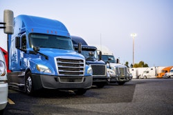Line Of Trucks In Row Starting With Blue Truck