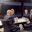 Group Of Men In A Business Meeting